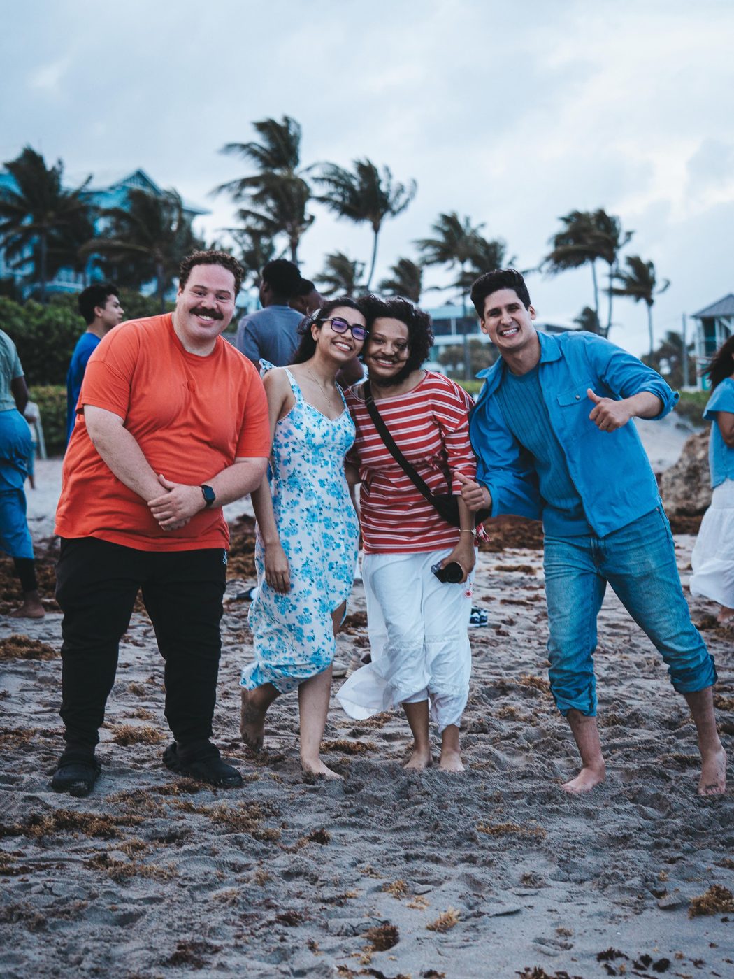 Friends laughing together on the beach