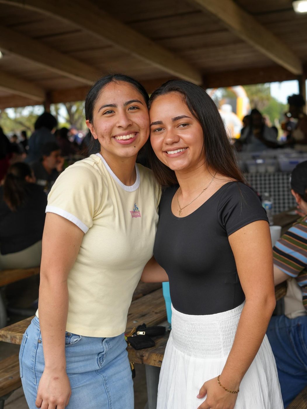 Two young women smiling at the church picnic